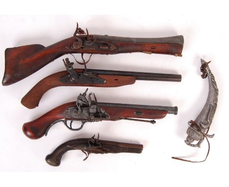 A collection of 4x vintage replica / display Flintlock pistols. All made of wood and metal, to varying degrees of quality. So