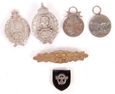 A collection of 6x WWI First and WWII Second World War related German military badges and awards. To include; Close Combat aw