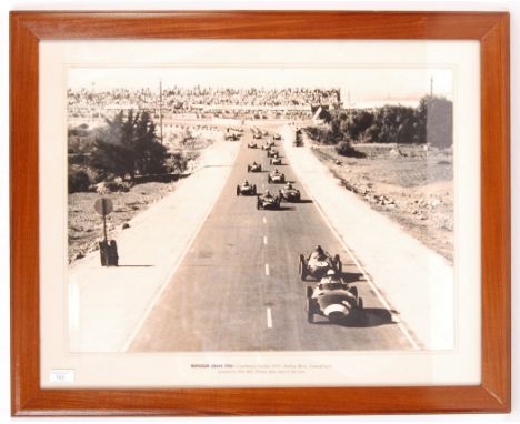 A large framed and glazed 1970's photographic print depicting the 1958 Moroccan Grand Prix - ' Stirling Moss, Vanwall Hotly P