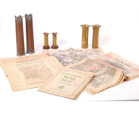 A collection of WWII Second World war related newspapers along with 3x pairs of trench art ammunition cases from WWI &amp; WW