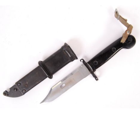 A 20th century AK47 / short rifle bayonet. Serrated edge, with original scabbard. Stamped 5998 to sheath, with the guard stam