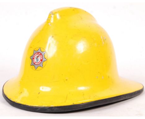 A vintage local interest ' County Of Avon Fire Brigade ' Fireman's helmet. Yellow, with Bristol related decal to front. Named