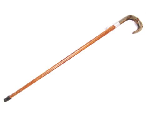 A 20th century walking sword stick cane. Long wooden shaft, with a curved horn handle. Handle pulls off to reveal a short dou