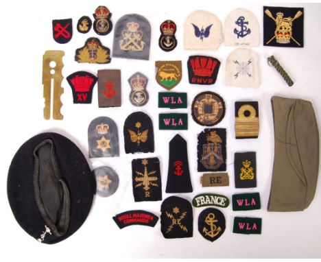 A collection of assorted military uniform patches / militaria. Various periods and conflicts, including a post-war German for