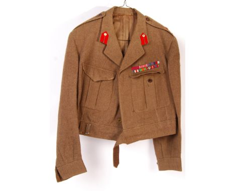 A post-WWII Second World War (1957) Private Purchase battle dress uniform blouse, named to a Brigadier C.E. Welby Everard. Th