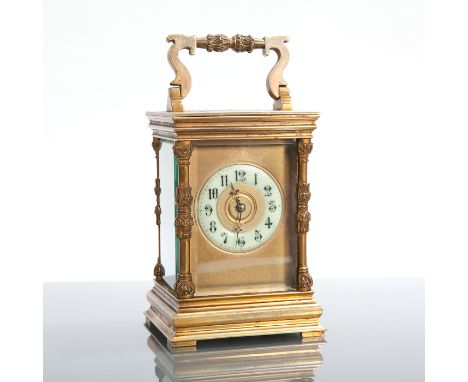 LATE 19TH CENTURY FRENCH BRASS  CARRIAGE CLOCK with foliate column case and circular enamel Arabic dial, the movement with pl