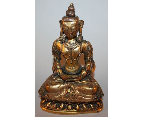 A GOOD 17TH/18TH CENTURY CHINESE GILT COPPER MODEL OF AMITAYUS, seated in dhyanasana on a double lotus plinth, the edges of h