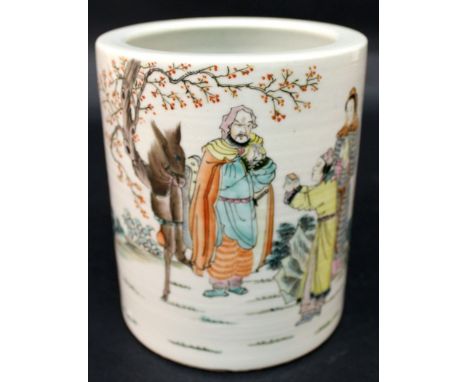 A CHINESE FAMILLE ROSE PORCELAIN BRUSHPOT, painted with calligraphy and a scene of figures conversing in a garden setting, th