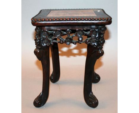 A SMALL CHINESE MARBLE-TOP CARVED HARDWOOD STAND, on four scroll-end feet and with a pierced prunus blossom frieze, 7.8in squ