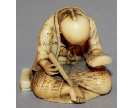 AN UNUSUAL & FINE QUALITY 19TH CENTURY JAPANESE MEIJI PERIOD IVORY NETSUKE OF A MASK MAKER, unsigned, unusually carved with a