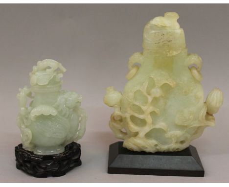 TWO CHINESE JADE-LIKE VASES & COVERS, each with a fitted hardwood stand, the vases themselves 4.9in high & 7.4in high overall