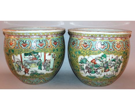 A GOOD LARGE PAIR OF 19TH CENTURY CHINESE FAMILLE VERTE JARDINIERES, the rounded exterior sides painted with shaped panels of