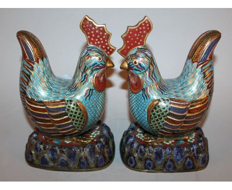 A PAIR OF RARE & FINE QUALITY CHINESE JIAQING PERIOD CLOISONNE MODELS OF CHICKENS, circa 1800/20, each seated on an unusual s
