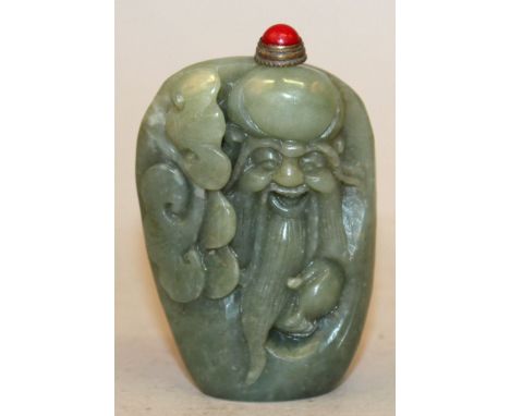 A GOOD QUALITY CELADON GREEN JADE SNUFF BOTTLE & STOPPER, the pebble-form body carved in relief with Shou Lao and a frond of 