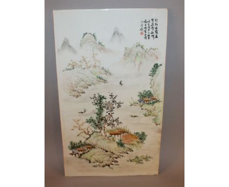 A CHINESE PORCELAIN PLAQUE, decorated with calligraphy and a river landscape scene, 22.1in x 12.9in. 