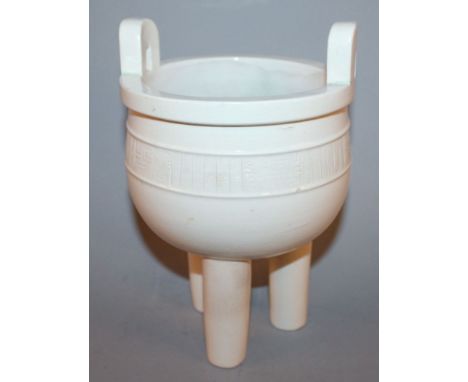 A CHINESE WHITE GLAZED DEHUA CERAMIC DING TRIPOD CENSER, the sides decorated beneath the glaze with a narrow band of archaic 