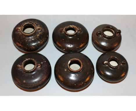 A GROUP OF SIX SIMILAR THAI SAWANKHALOK CERAMIC JARLETS, each applied with a brown glaze, most with double lug handles, 14th/