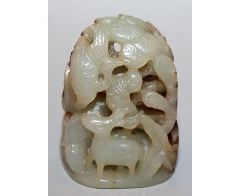 A CHINESE CELADON JADE CARVING OF DEER AND STORKS, in a grove of bamboo, pine and lingzhi, the stone with brown inclusions, 2