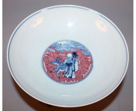 A CHINESE UNDERGLAZE-BLUE & RED ENAMEL GROUND PORCELAIN BOWL, together with a wood stand, the bowl decorated with the Eight I
