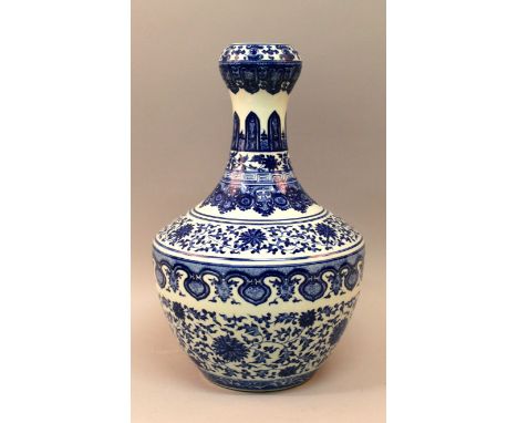 A LARGE CHINESE MING-STYLE BLUE & WHITE PORCELAIN VASE, decorated with bands of scroll and leaf stemmed lotus between formal 