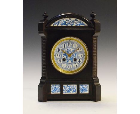 19th Century Aesthetic School ebonised cased mantel clock, the ceramic dial with Arabic numerals and blue transfer printed fr
