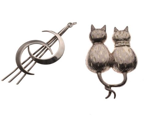 Two hallmarked silver brooches, the first modelled as two cats with tails entwined, the second a double crescent brooch, larg