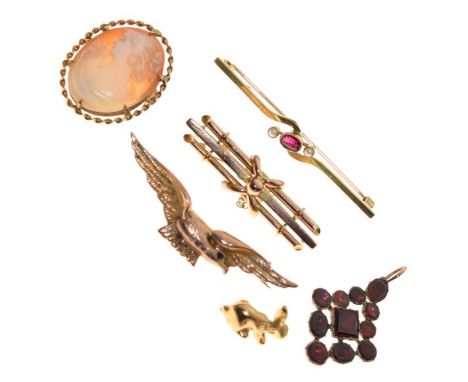 Six items of jewellery comprising: 9ct gold shell cameo brooch with oval female profile portrait, yellow metal eagle brooch s