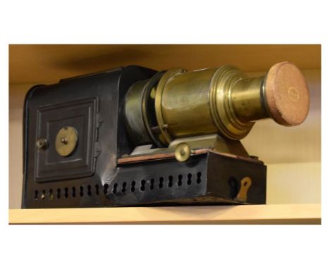 Early 20th Century lacquered brass and black painted metal magic lantern   Condition: 