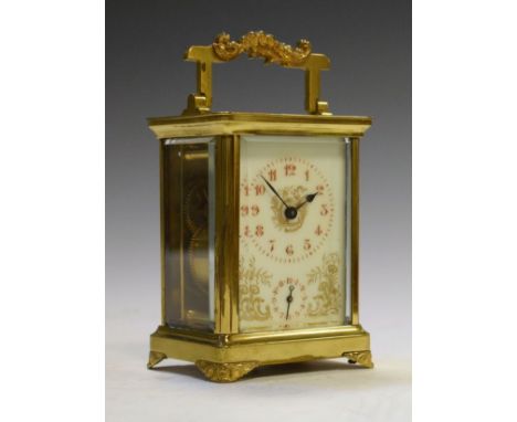 French brass cased carriage clock, the off-white dial with Arabic numerals, foliate decoration and subsidiary alarm dial   Co