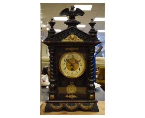 Early 20th Century Vienna-style mantel clock with cream Arabic chapter ring beneath eagle pediment   Condition: 