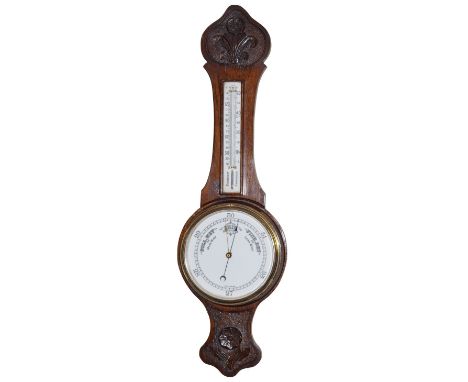 Early 20th Century carved oak framed aneroid barometer and thermometer   Condition: 
