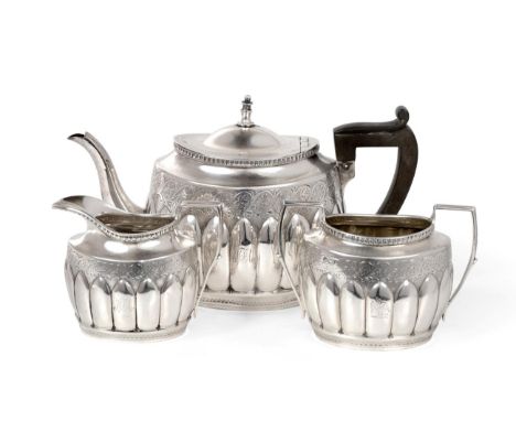 A Victorian Silver Three Piece Tea Service, James Henry & Herbert Barraclough, Sheffield 1890, oval, engraved with a band of 