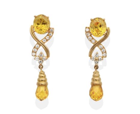 A Pair of Yellow Zircon and Diamond Earrings, an oval cut yellow zircon in a claw setting suspends a briolette yellow zircon 