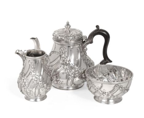 A Late Victorian Silver Bachelor's Three Piece Tea Service, Thomas William Dobson, London 1897, spirally fluted and decorated