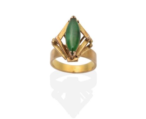 A Jade Ring, a marquise cabochon jade in a claw setting, within a high set kite-shaped bar frame, finger size K see illustrat