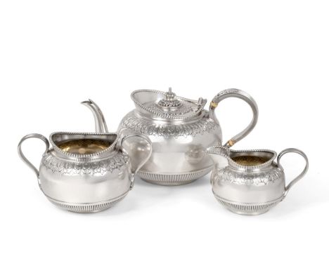 A Late Victorian Bachelor's Silver Three Piece Tea Service, Martin & Hall, London 1893, circular with bead rim, reeded handle