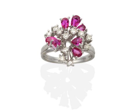 A Ruby and Diamond Cluster Ring, vari-sized pear cut rubies, intersperced with eight-cut diamonds in claw settings, to a reed