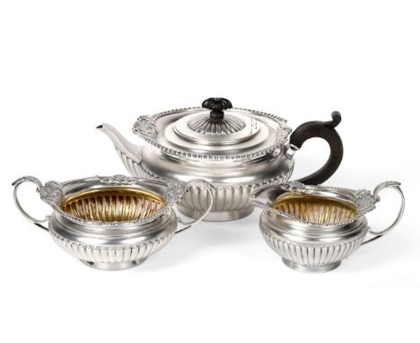 A Victorian Silver Three Piece Tea Service of George III Style, Walter & John Barnard, London 1891, squat circular and part f