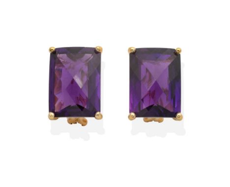 A Pair of 14 Carat Gold Amethyst Earrings, rectangular checker-board cut amethyst in claw settings, measures 18mm by 13mm, wi