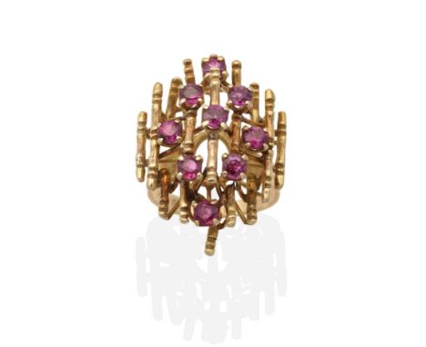 A Ruby Cluster Ring, round cut rubies in claw settings, to a cluster of bamboo motif bars, finger size K see illustration  Th