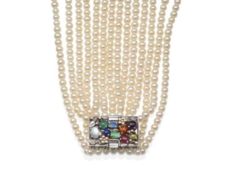 A Seven Strand Cultured Pearl Necklace, with a Multi-Gemstone Dorrie Nossiter-Style Clasp, uniform strands of cultured pearls