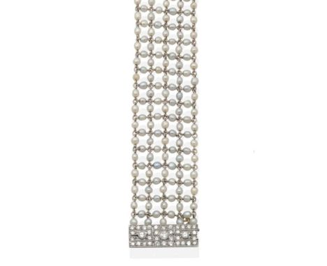 An Art Deco Pearl and Diamond Bracelet, five strands of pearl beads, connected by jump rings, to a rectangular clasp, with th