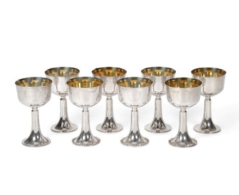 A Set of Eight Silver Goblets, probably Thomas Fattorini, Sheffield 1972, the plain bowl with gilt interior, on trumpet shape