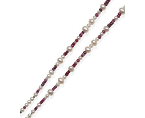 A Ruby and Cultured Pearl Necklace, graduated faceted shaded ruby beads spaced at intervals by cultured pearls and rough diam