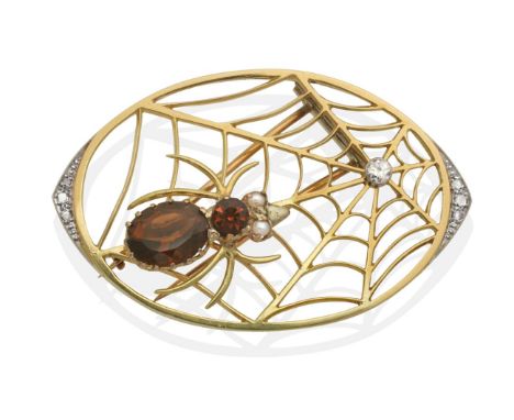 A Novelty Citrine, Diamond and Pearl Spider Brooch, a citrine set spider, with pearl set eyes, to a web with a central old cu