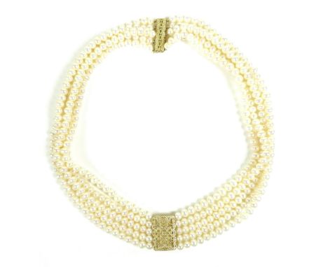 A multi-strand cultured pearl necklace, on a gold and white stone set slide clasp, each pearl approximately 5-6mm each, 42cm 