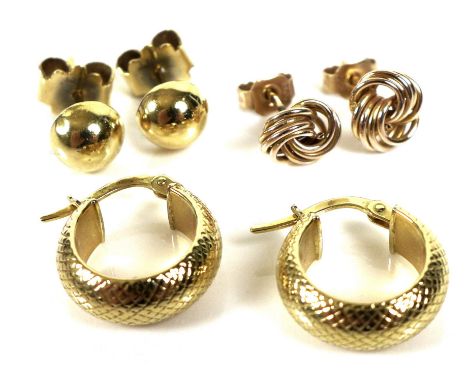 Three pairs of gold earrings, the first an 18ct gold pair of engraved hoops, each 1.6cm across, marked 750, 2.8g, the second 