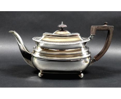 An Edward VII silver teapot, of London shape with decorative gadrooned upper rim, hinged cover with finial, ebonised wooden h