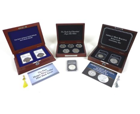 Three case set of silver US dollars and half dollar coins, comprising "The first Morgan silver dollar mint mark errors" set o