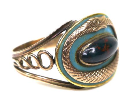 A 9ct gold ring of ouroboros design, the central plaque of turquoise enamel with an engraved gold relief ouroboros encircling